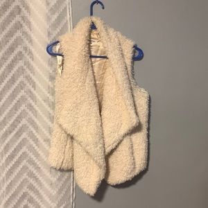 Calvin Klein size small faux-fur cream colored open vest, never worn